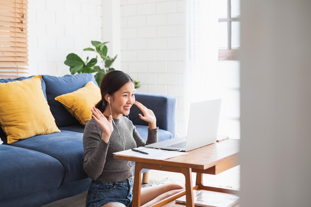 young-asian-businesswoman-work-home-virtual-video-conference-meeting-with-colleagues-business-people-online-working-video-call-due-social-distancing-home-office_928174-849
